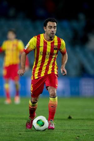 Xavi Tulang Punggung Barcelona
