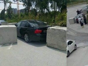 Diparkir Sembarangan, Mobil BMW Ini Dijebak Pakai Batu Beton